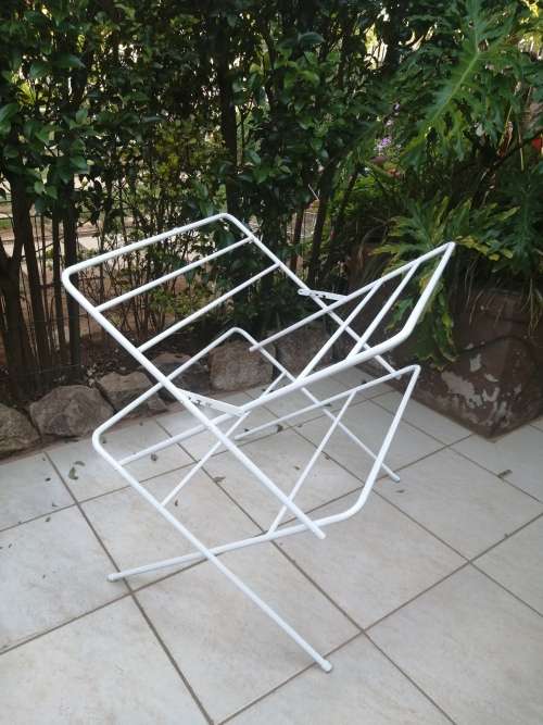 Old metal fold up clothes dryer.