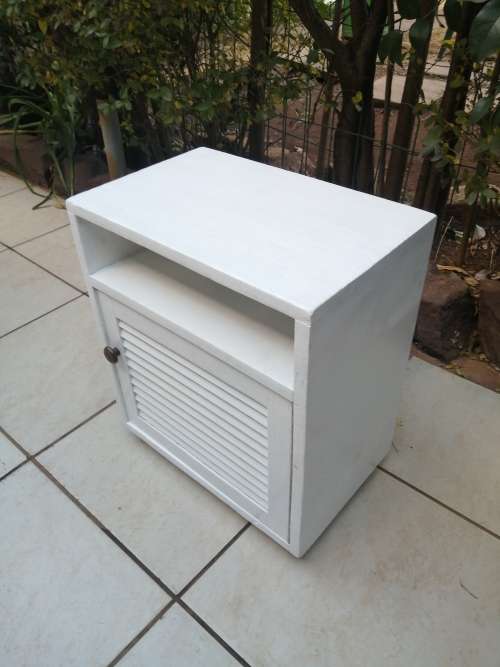 Single white bedside cabinet.