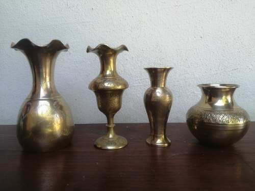 Collection  of 4 small brass posy vases.