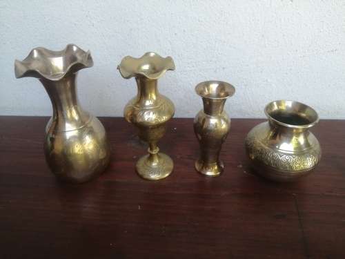 Collection  of 4 small brass posy vases.