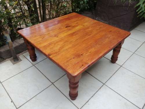 Beautiful large square solid wood coffee table.