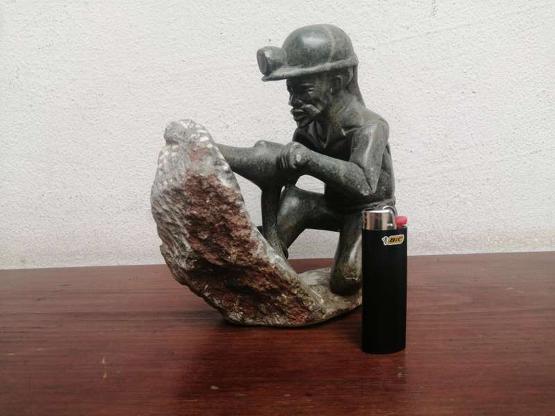 Beautiful carved stone miner.