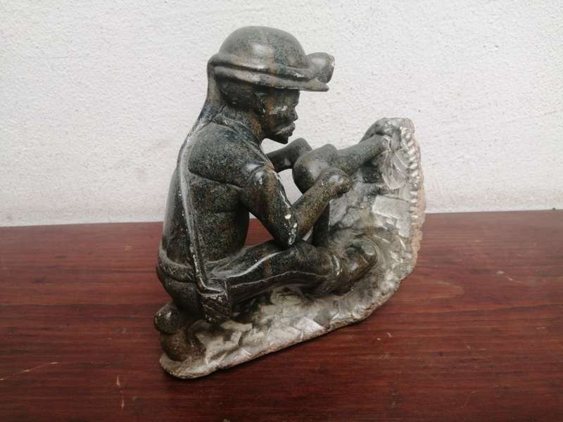 Beautiful carved stone miner.