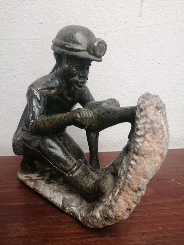 Beautiful carved stone miner.