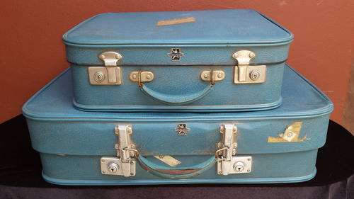 Pair of blue Caravelle suitcases.