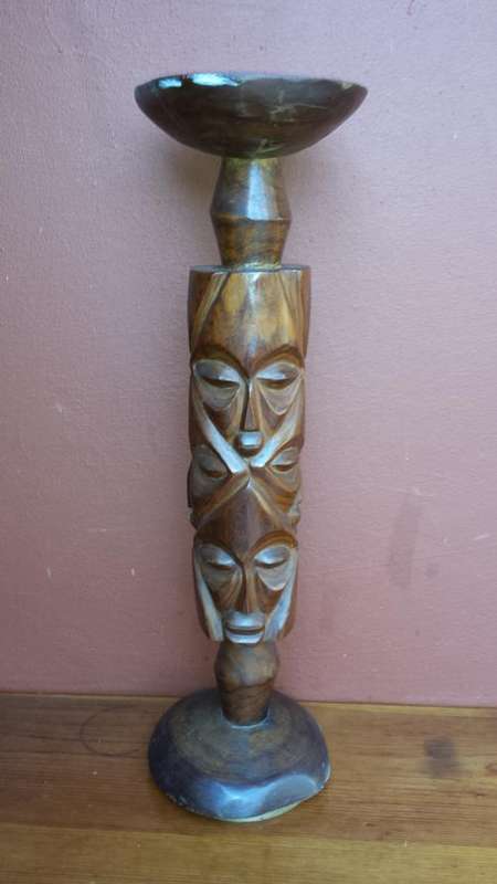 Tall, carved wooden plant stand.