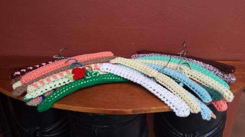 Set of 25 crocheted covered wooden hangers.