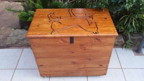 Large pine box on coasters.