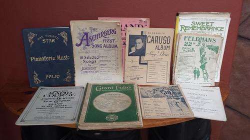 Collection of really old piano sheet music.