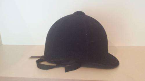 Blue velvet horse riding hat.