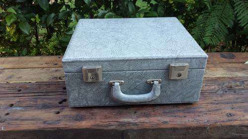 Lovely grey, square suitcase.