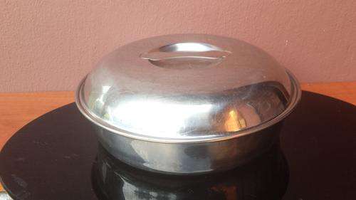 Round stainless steel serving dish.