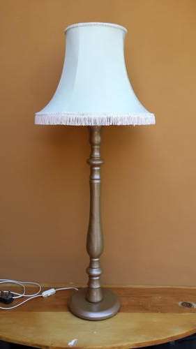 Tall, wooden table lamp.