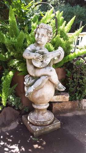 Awesome manderine playing angel statue.