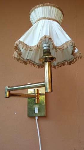 Awesome wall mounted brass adjustable light.