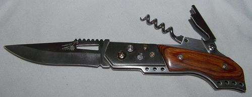FLICK KNIFE WITH A BOTTLE OPENER AND CORKSCREW