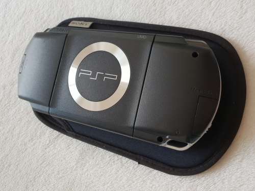 Playstation Portable (PSP 1000) + Original box + 7 Games