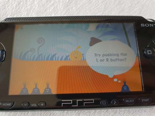 Playstation Portable (PSP 1000) + Original box + 7 Games