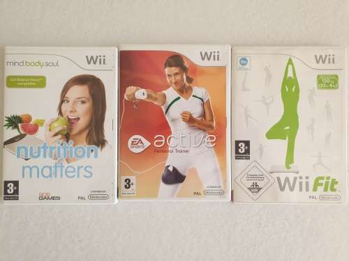 Nintendo Wii Balance Board + Wii Fit,EA Active and Nutrition Matters