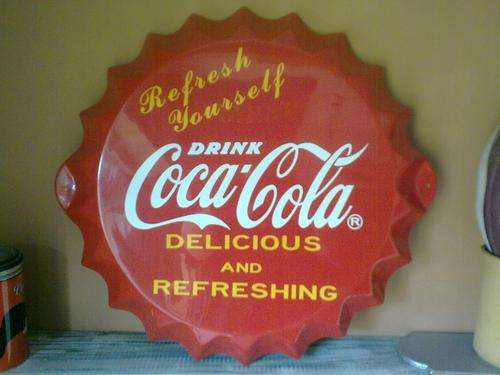Coca Cola bottle cap sign