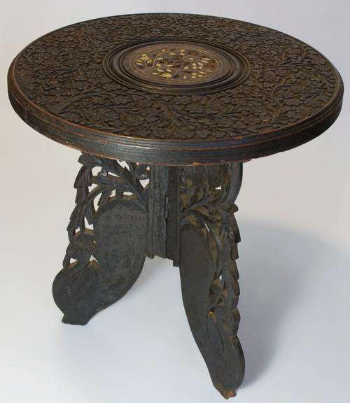 Vintage three-legged wooden stool