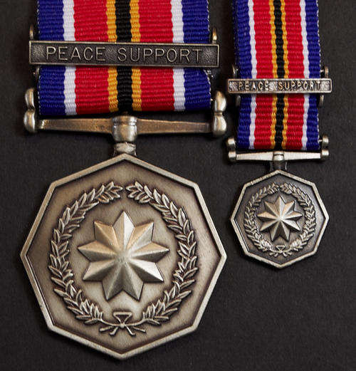 SANDF General Service Medal with PEACE SUPPORT Bar - Numbered full size plus miniature - mint cond.
