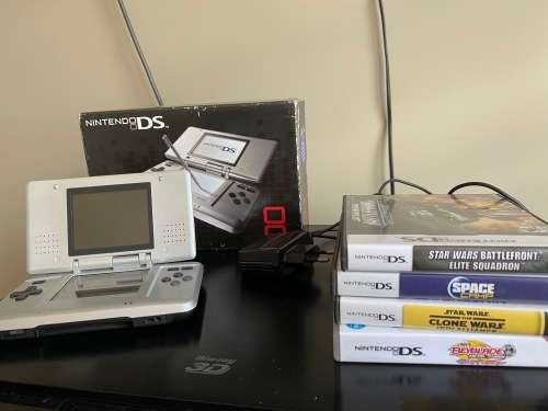 Original Nintendo DS with 4 Games In Original boxing with charger Fantastic Condition
