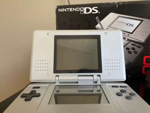 Original Nintendo DS with 4 Games In Original boxing with charger Fantastic Condition