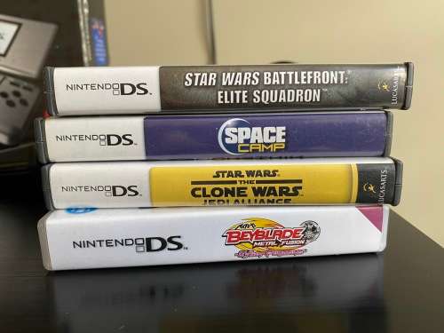 Original Nintendo DS with 4 Games In Original boxing with charger Fantastic Condition
