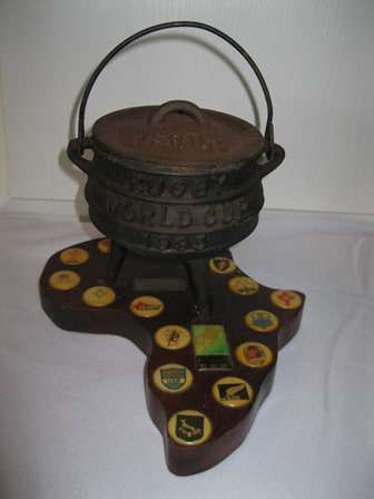 World Cup Rugby 1995 Potjie Pot on a Wooden Africa Map with the Badges of Participating Countries