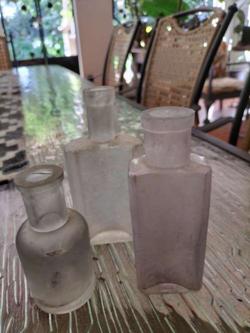 Group of  Frosted Vintage Anthropology Bottles
