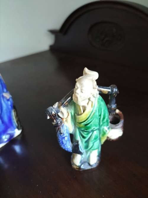 Pair  of Mudman Figurines