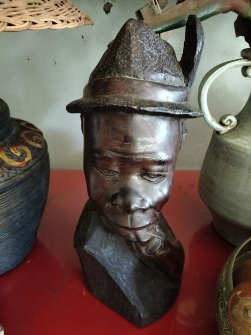 Wooden African Bust with a man with a Hat