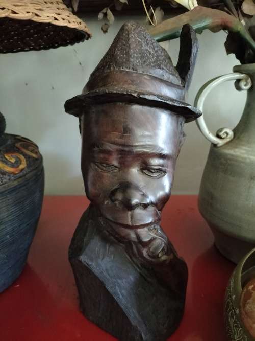 Wooden African Bust with a man with a Hat