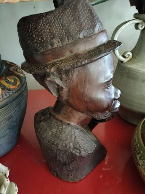 Wooden African Bust with a man with a Hat