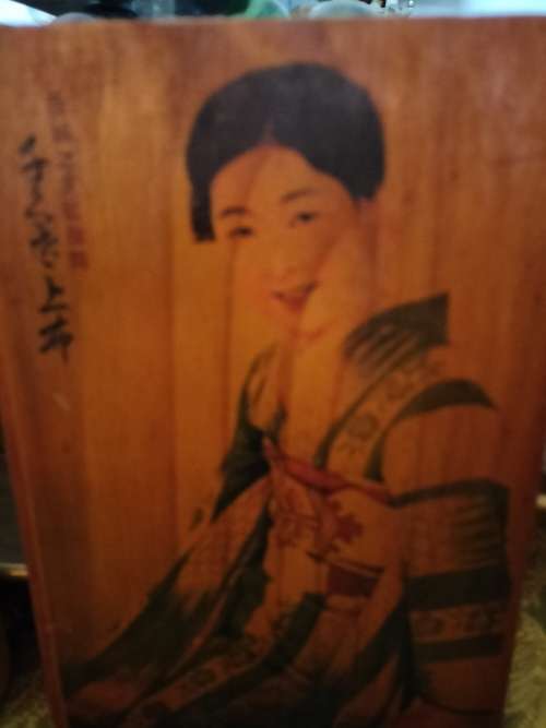Pair of Wooden Plaques with Oriental Ladies