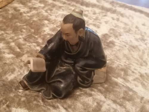 Chinese Mudman reading a book