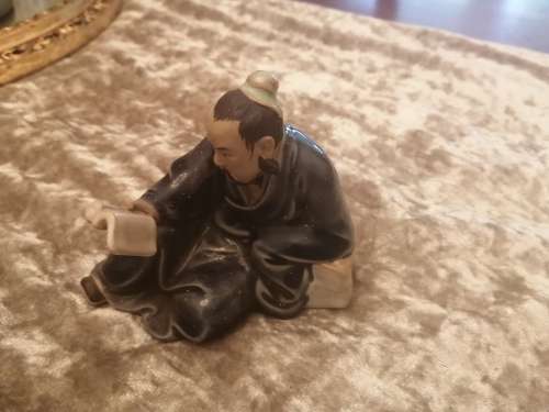 Chinese Mudman reading a book