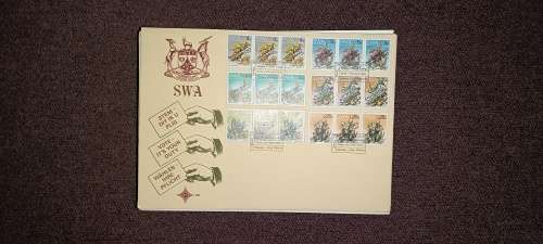 Over 200 stamps on envelopes mostly south africa