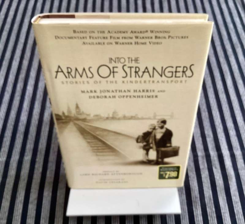Into the Arms of Strangers. Hardcover, first edition.
