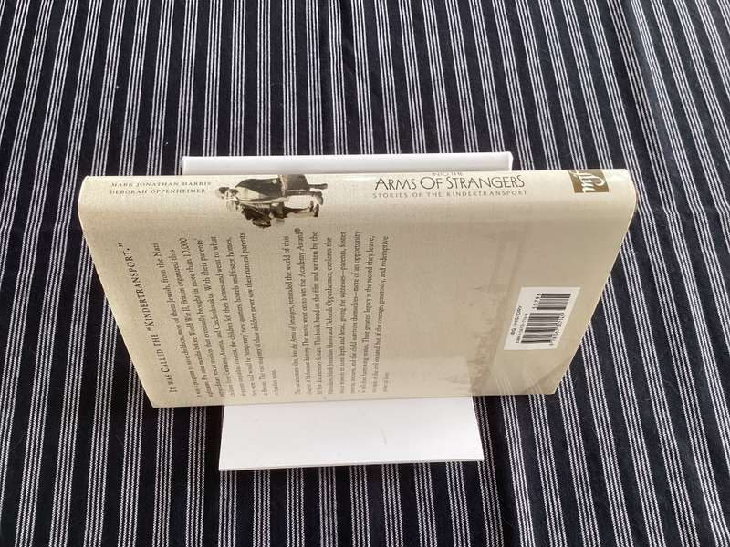 Into the Arms of Strangers. Hardcover, first edition.