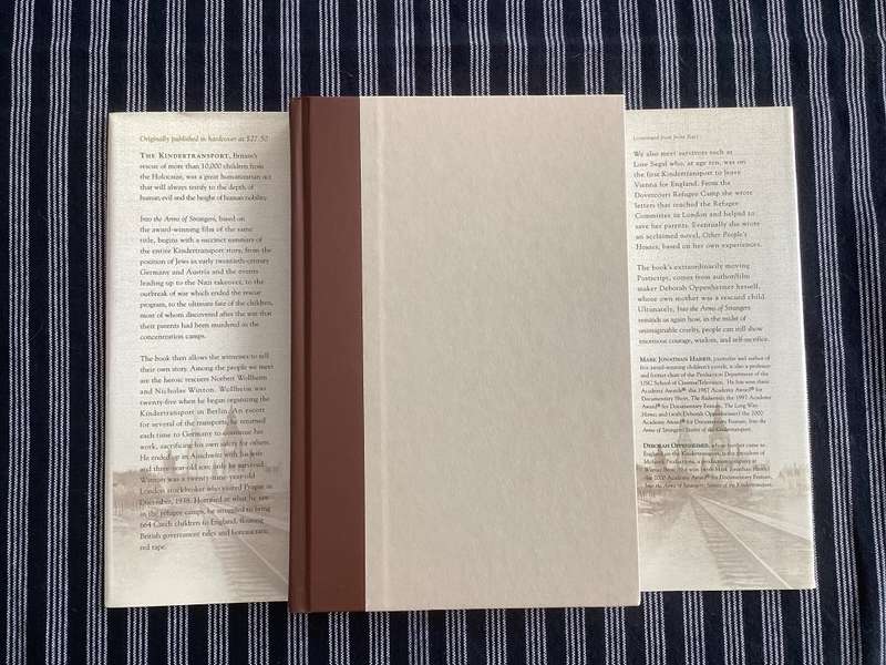 Into the Arms of Strangers. Hardcover, first edition.