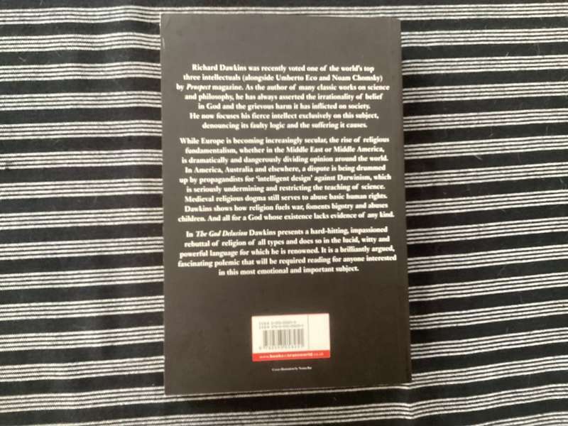 The GOD Delusion, by Richard Dawkins, Large format Paperback in a Fine Condition.