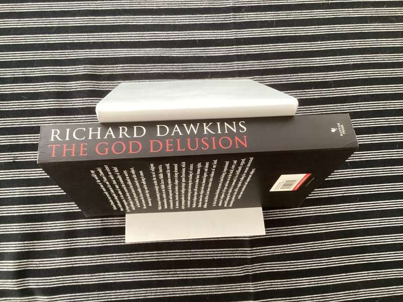 The GOD Delusion, by Richard Dawkins, Large format Paperback in a Fine Condition.