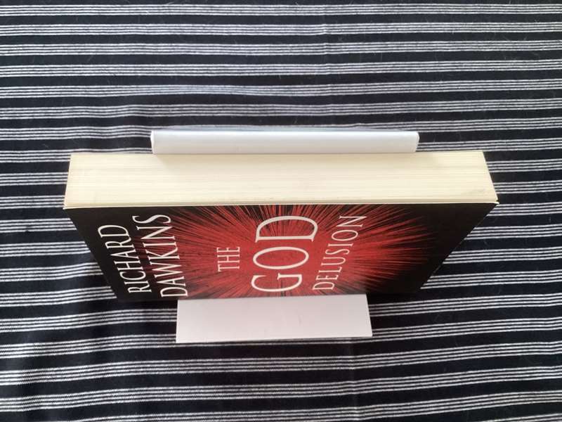 The GOD Delusion, by Richard Dawkins, Large format Paperback in a Fine Condition.