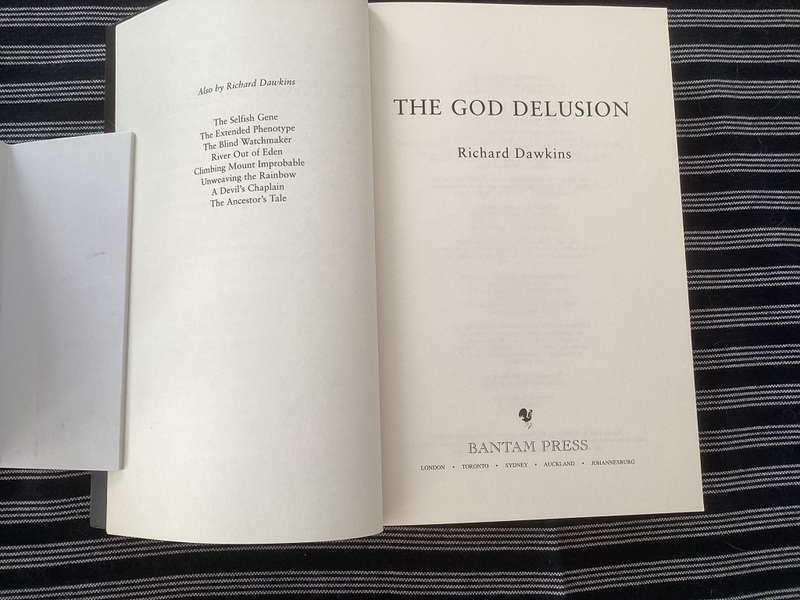 The GOD Delusion, by Richard Dawkins, Large format Paperback in a Fine Condition.