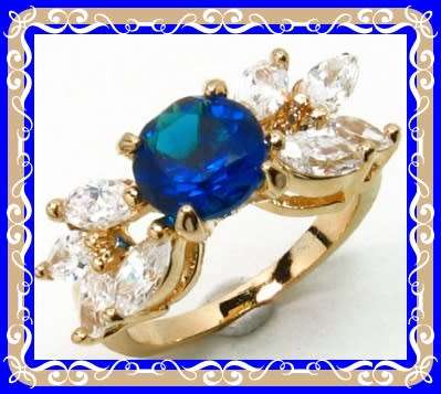 Blue simulated sapphire and topaz leaf design ring