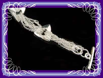 Lovely vintage look silvertone bracelet with triangle shapes