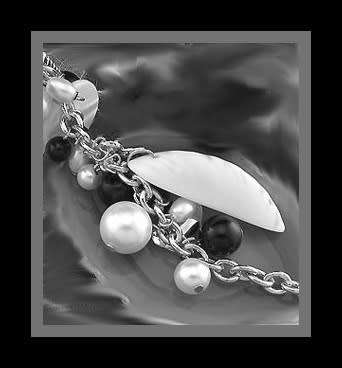 Silver bracelet with simulated pearl and shell charms