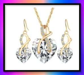 Crystal heart pendant and earring set gold plated with white simulated stones